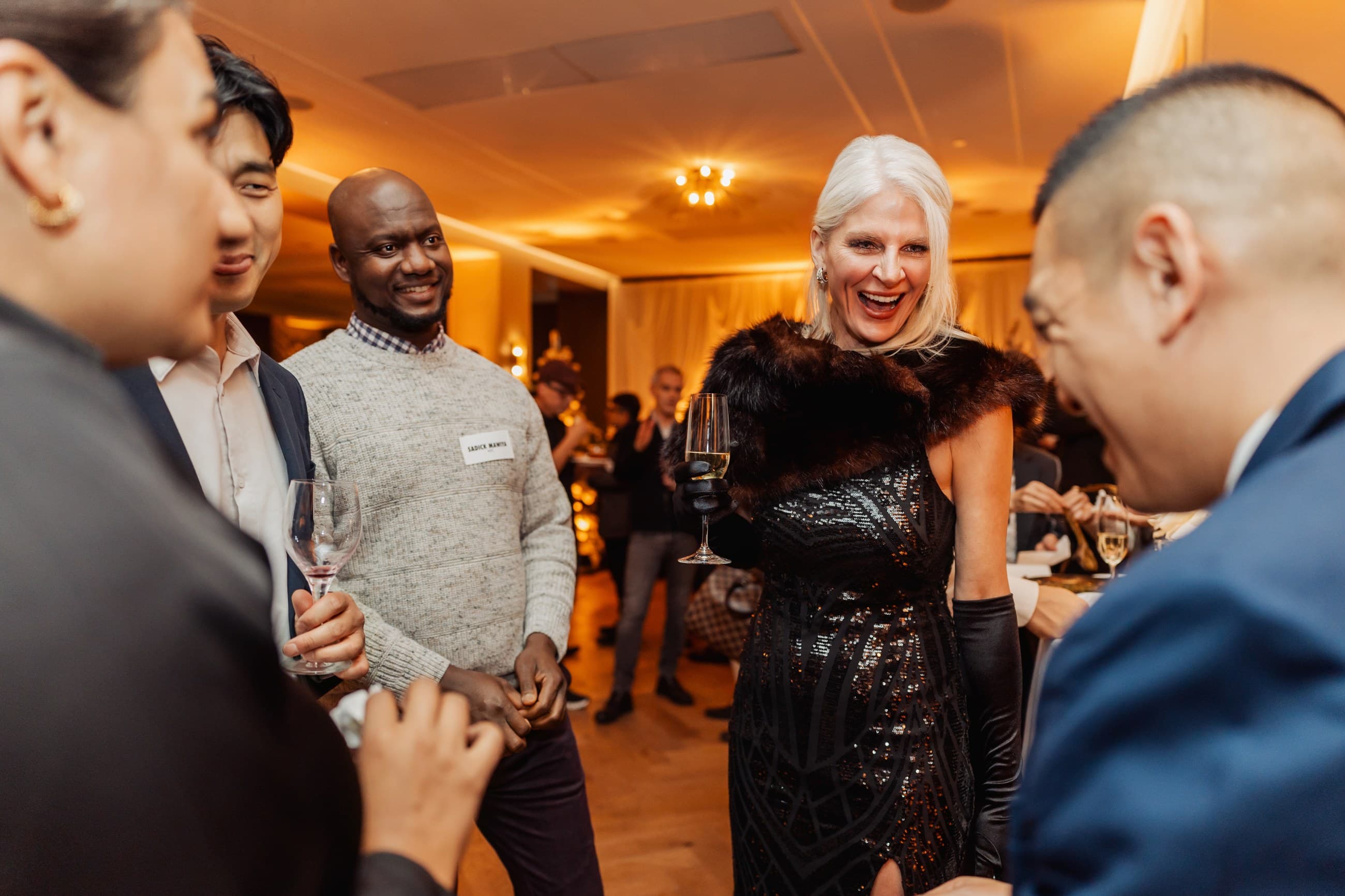 Corporate guests reacting to close-up magic with John Ha