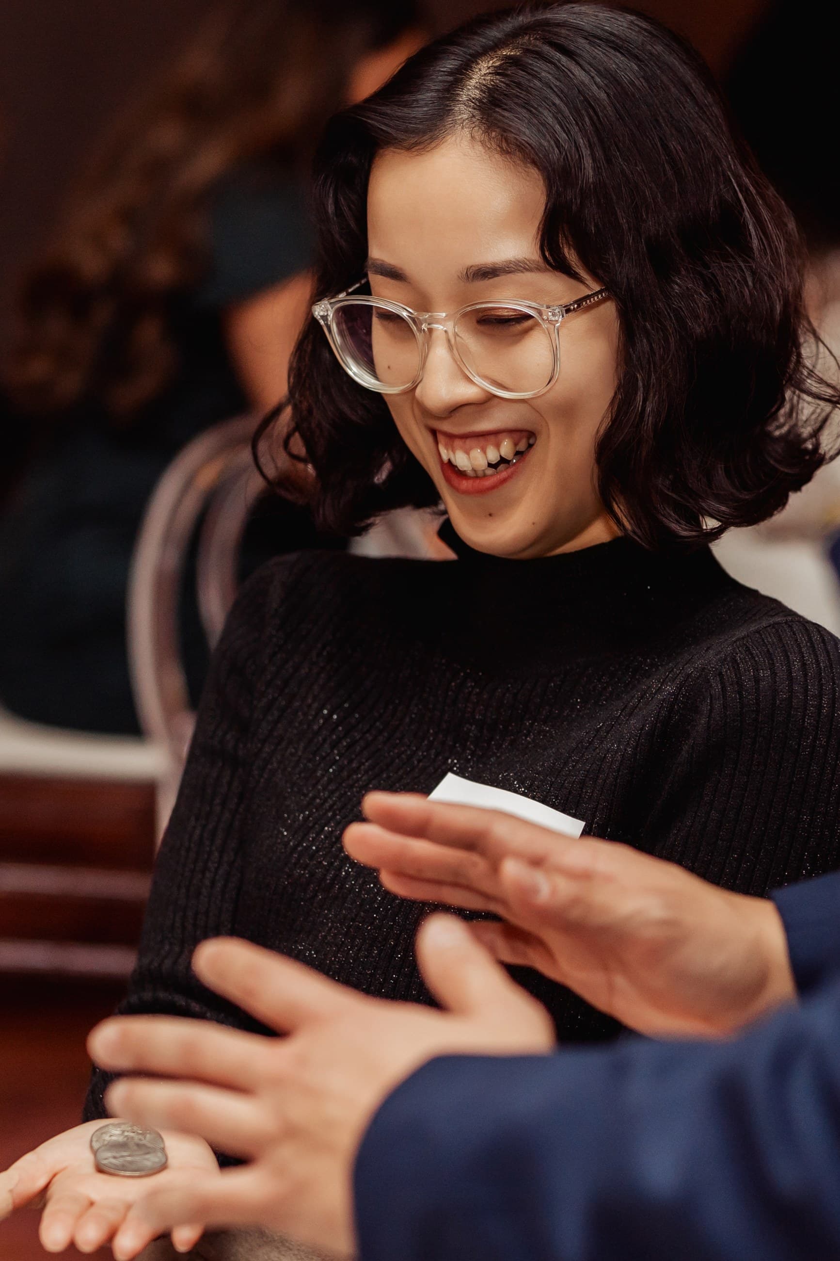 Guests reacting to close-up magic by John Ha
